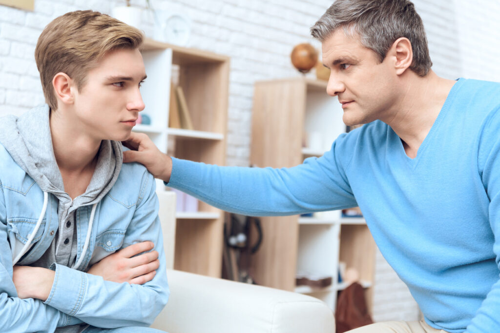 father talking to teen son