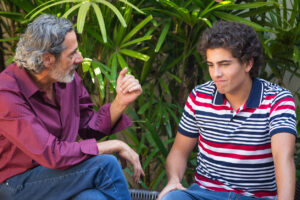 father talking to teen son