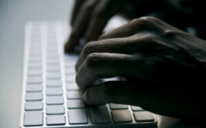 hands on a computer keyboard