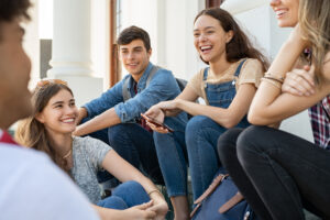 group of happy teens smiling