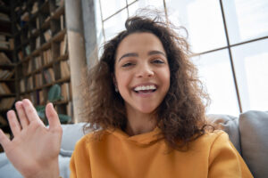 happy teen girl waving