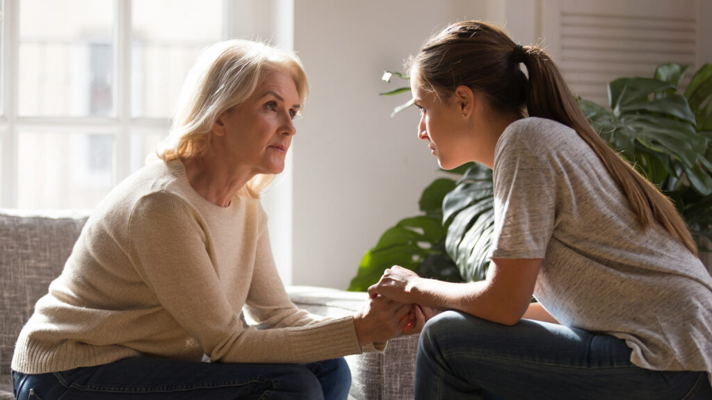 mom talking to teen daughter