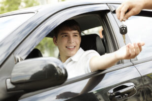 teen boy handed car keys