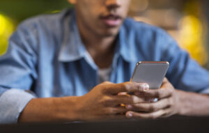 teen boy chatting on phone