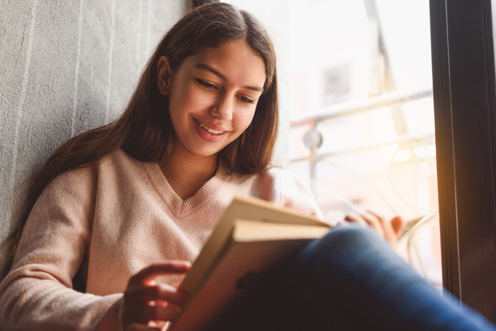 teen reading ya novel