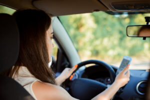 teen girl texting and driving