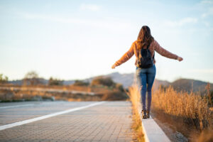 teen walking along road