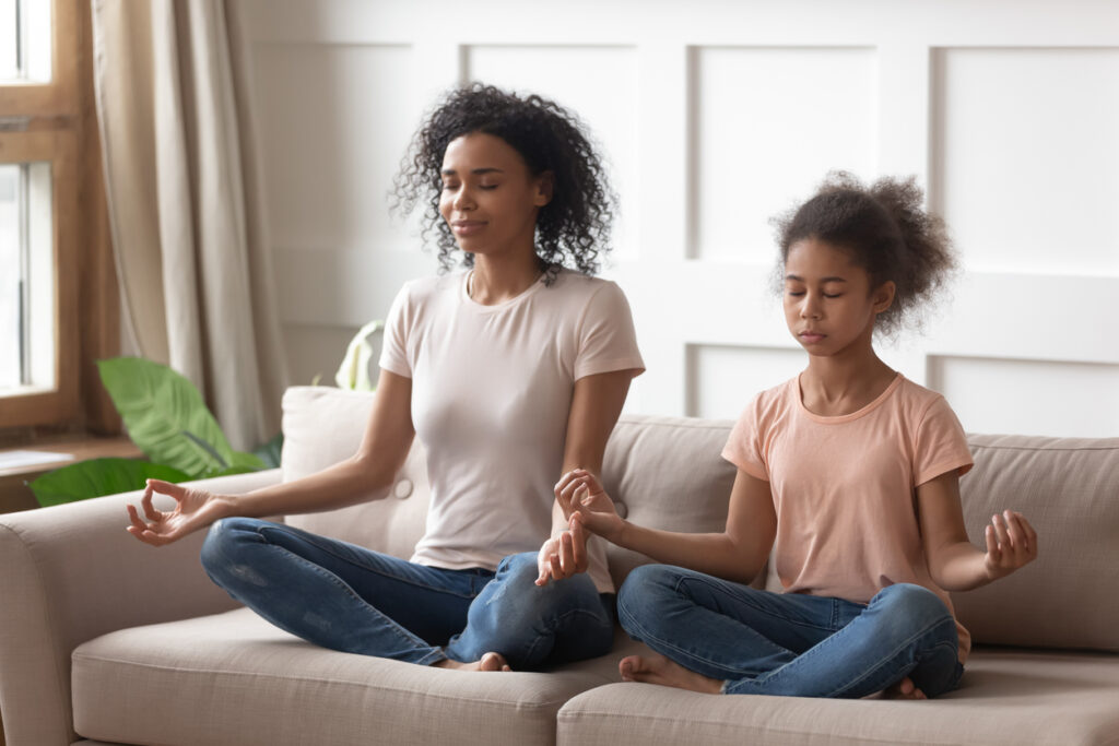 teen girl and mom meditating